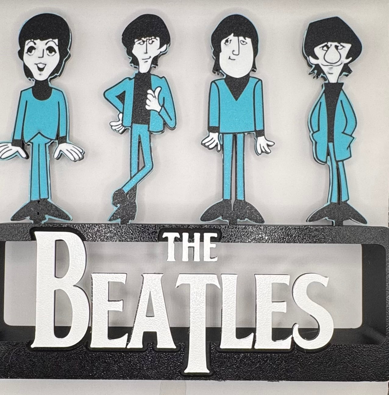 The Beatles cartoon stand